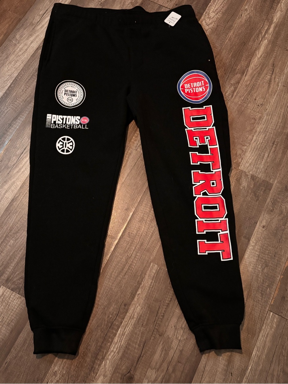 NBA Men Black Sweatpants with Red Detroit Lettering. 215